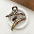 Front view of two Acrylic tartan hair claw in red, green, and beige plaid.