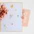 Flat lay of Thank You Card on table.