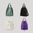 Group display of the ultralight 2-way backpack in green, black, white, and purple.
