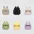 Front view of Six polyester Ultralight Urban Daily Backpacks in beige, black, cream, green, yellow, and lavender.