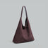 Three-quarter view of the dark brown vegan suede hobo bag.