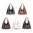 Five waxed leather hobo bag in black, brown, white, ancora red and caramel on a white background.