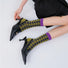 Model wearing a pair of Wild Birds Socks, great for casual wear and light workouts.