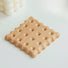 Detail view of Wooden Biscuit Coaster in square shape.