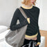 Model carrying a gray tote bag as shoulder bag, ideal for daily carry and travel.