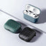 Angled view of three Woven AirPods Case Covers, two closed and one open.