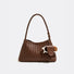 Front view of Brown woven PU leather shoulder bag with a detachable glasses holder and sunglasses, great for everyday.