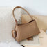 Flat lay of Woven Leather Bag With Glasses Holder in khaki, great for everyday carry and travel.