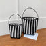 Comparison view of the large and small sizes of the woven raffia bucket bag.