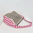Close-up of Zesty Stripe Canvas Tote Bag with brown and white striped body, and pink and white striped strap.
