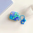 Funda de AirPods con diseño de pintura al óleo de flores en azul