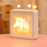 Angled view of Carved Paper Lamp in unicorn pattern , great for home decor and gifting.