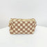Coffee color of checkered knit makeup bag; versatile neutral accessory for cozy desk organization.