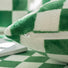 Detail view of green Checkerboard Pillow Cover, showcasing the material and zipper.
