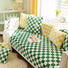 Green and yellow Checkerboard Pillow Covers on a couch with green checkered blanket, ideal for home decor.