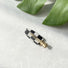 Front view of checkered hair claw in arrow shape, easy for workdays and special occasions.