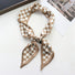 Angled view of Checkered Silk Like Skinny Scarf, great for office layering and commuting.