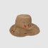 Front view of the khaki straw hat, showing its flexible brim and foldable material.