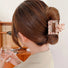 Model wearing Color Square Hair Claw in coffee, easy for workdays and special occasions.