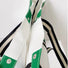 Close-up of the green striped canvas tote bag showing the interior button and handle.