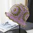 Front view of purple Floral Crochet Hat. Vibrant artistic patterns on a skin-friendly knitted frame.