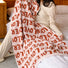 Flat lay of bath towel with repeating LOVER text.