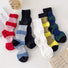 Six pairs of ribbed, cotton-blend Lantern Colored Socks in red, blue, black, white, olive, and navy.