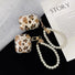 Two sizes of Leopard print silicone AirPods cases with pearl wrist strap and gold charms.