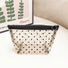Trapezoid shaped organza cosmetic pouch; stylish and lightweight mesh organizer under $20.