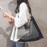Large nylon tote with an artistic maze design, perfect for casual city styling.