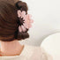 Model wearing Moon Hair Claw in pink, easy for workdays and special occasions.