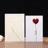 Close-up of embossed Red Love Card, perfect for gifting.