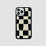 Black and white sherpa checkered phone case with a black silicone frame. Soft textured design.