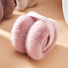 Front view of pink plush earmuffs; soft winter ear warmers with premium thermal guard.
