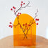 Angled view of Sunset Vase on the table, ideal for home decor.