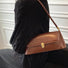 Brown PU leather vintage baguette shoulder bag with gold clasp and strap hardware.