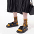 Model wearing a pair of  Abstract Pattern Crystal Socks with golden dots, ideal for everyday outfits and sneakers.
