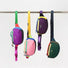 Four different colored AOIO flex belt bags hanging on a rack to show variety.