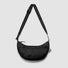 Front view of an black water-resistant nylon crescent sling bag with black elastic cord detailing.