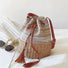 Colorful woven raffia straw bucket bag with brown PU leather drawstrings.