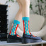 Model wearing a pair of blue and red Bold Hollow Socks, great for casual wear and light workouts.