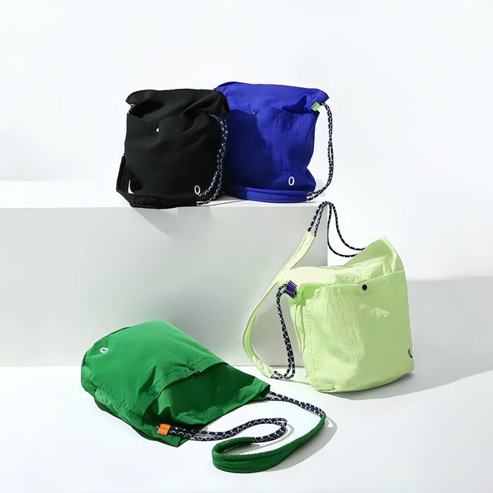 A collection of Breezy Trail Casual Bags in various vibrant colors, showcasing the ultra-light nylon construction.