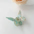 Close-up of butterfly hair claw in green, easy for workdays and special occasions.