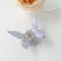 Folded view of butterfly hair claw in purple, ideal for quick updos and ponytails.
