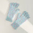 Mint candy-dot knit gloves with bobble dot texture and ribbed cuffs; cozy accessory for chilly weather.