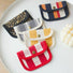 Assorted canvas coin purses with snap flap: red stripe, yellow gingham, leopard, and plaid patterns for small cash.