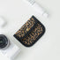 Leopard print canvas coin purse with black trim; snap-flap pouch for coins, lip balm, and small items.