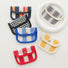 Canvas coin purses in mixed patterns—stripes, gingham, houndstooth, leopard—snap-flap mini wallets for coins/cards.
