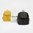 Three Check Mate Mini Backpack shown together, with drawstring and magnetic snap closures.
