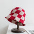 Front view of red checkered crochet bucket hat, crafted with a precise and trendy checkerboard pattern.